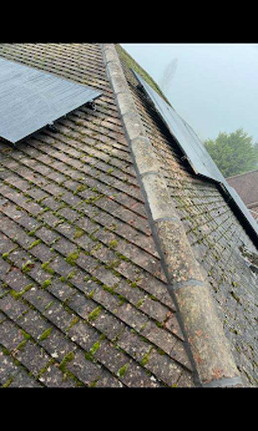 Hip tiles recemented by Marshall Roofing